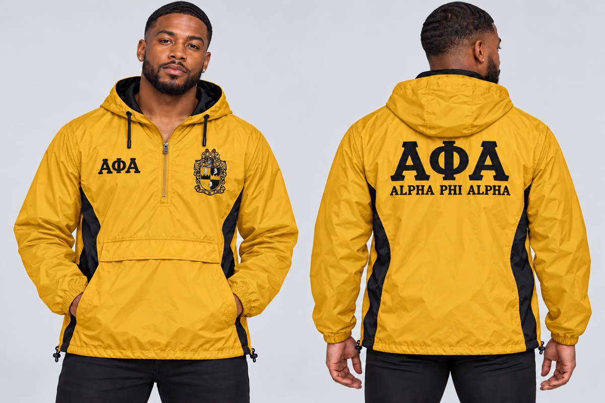 Black man modeling Alpha Phi Alpha old gold and black custom embroidered men's hooded anorak windbreaker jacket, front and back views.