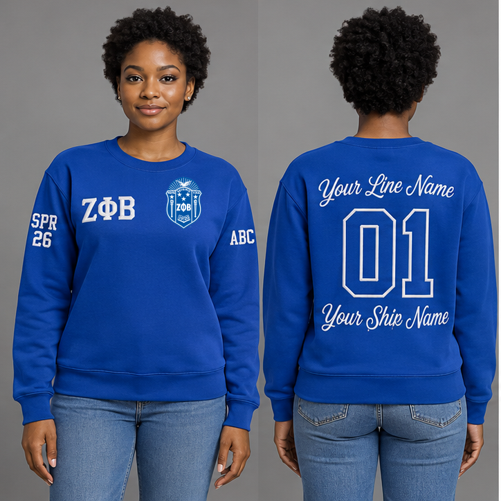 Zeta Phi Beta Royal Blue crewneck sweatshirt on an adult model, White Greek letters ΖΦΒ, original supplied crest, sample line name, line number 01 and ship name, right sleeve SPR 26 and left sleeve ABC.