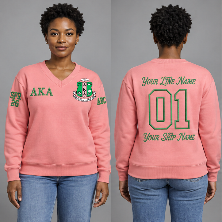 Alpha Kappa Alpha Salmon Pink V-neck sweatshirt on an adult model with Apple Green Greek letters ΑΚΑ, original supplied crest, sample line name, number 01 and ship name, crossing year and chapter initials on sleeves.