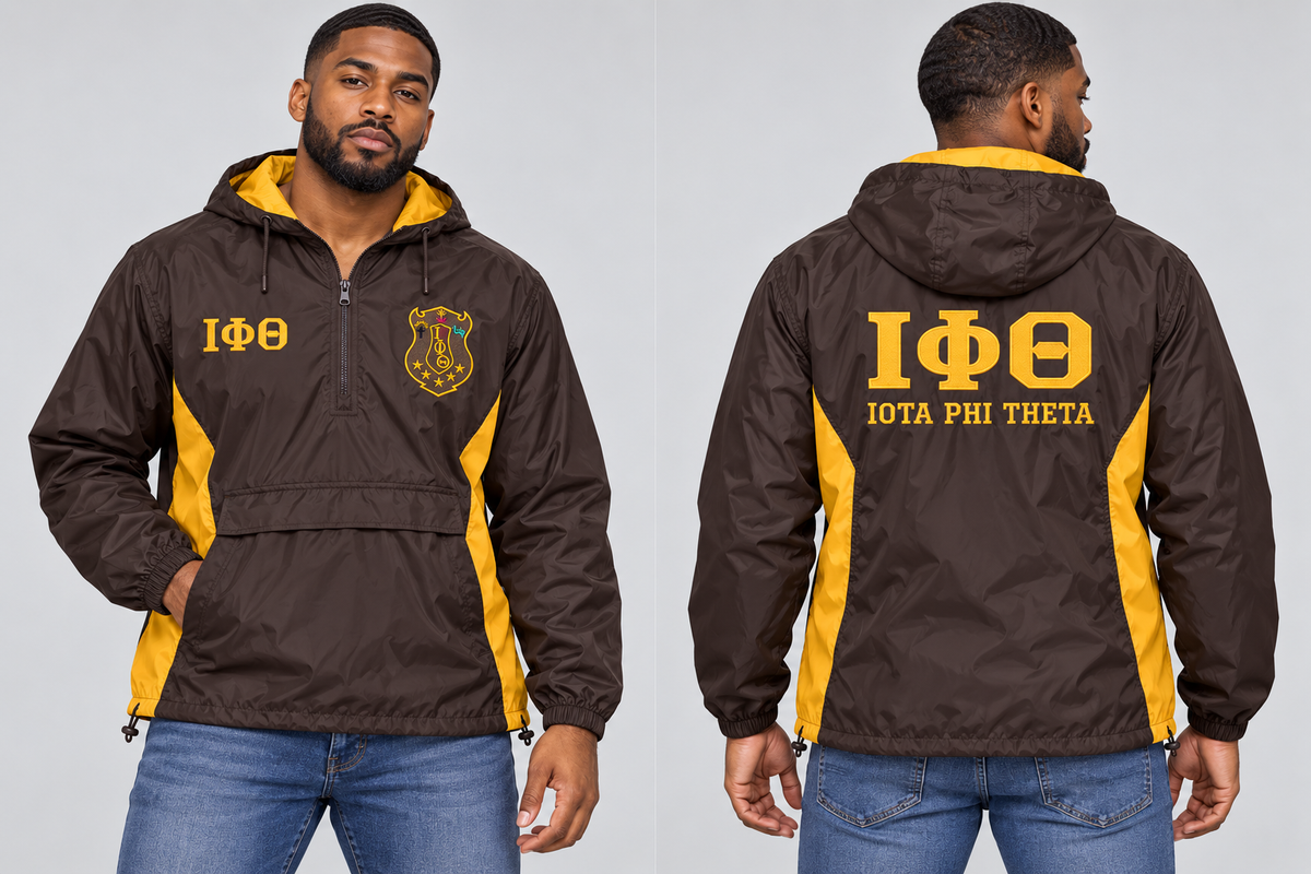 Black man modeling Iota Phi Theta charcoal brown and gilded gold custom embroidered men's hooded anorak windbreaker jacket, front and back views.