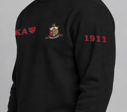 Kappa Alpha Psi premium embroidered black solid crewneck sweatshirt on model - founding year sleeve detail