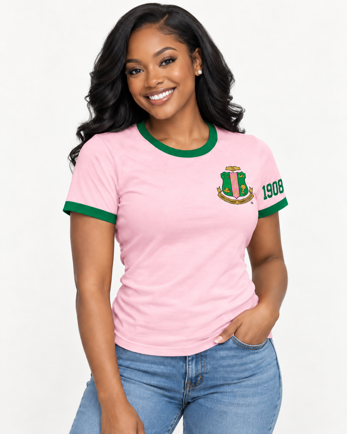 Model wearing a pink Alpha Kappa Alpha ringer T-shirt with green trim, chest crest and 1908 sleeve design