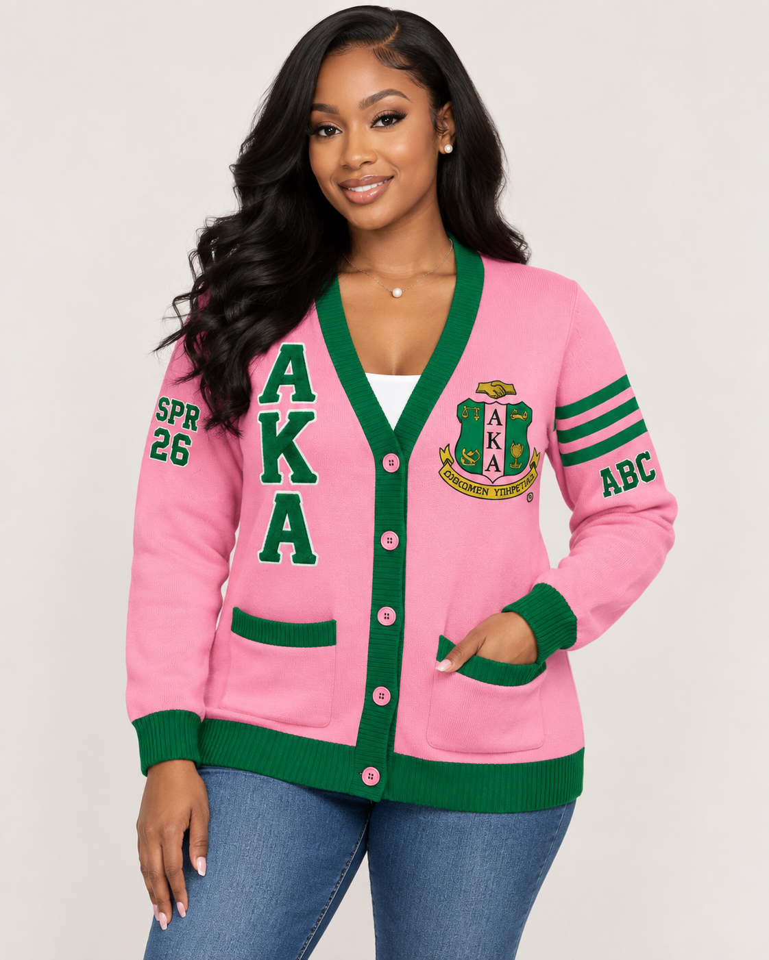Black female model wearing Alpha Kappa Alpha pink and green embroidered cardigan