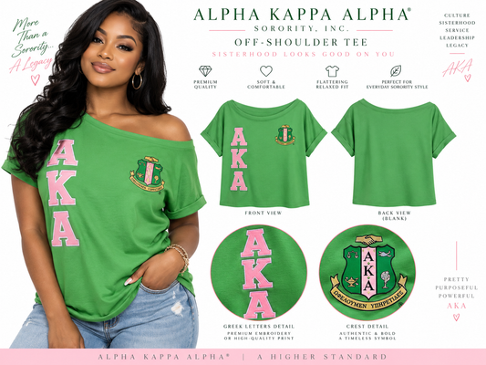 Green and pink Alpha Kappa Alpha off-shoulder tee shown on a woman with crest, stacked AKA letters, blank back, and embroidery details