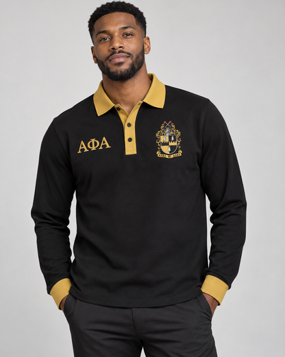 Alpha Phi Alpha man wearing black long-sleeve polo with old gold collar, placket, cuffs, crest, and Greek letters