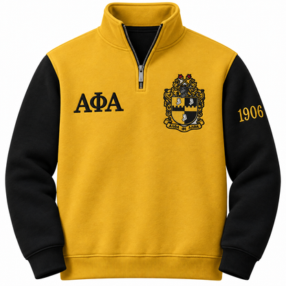 Alpha Phi Alpha old gold and black quarter-zip front with Greek letters, crest, and sleeve year