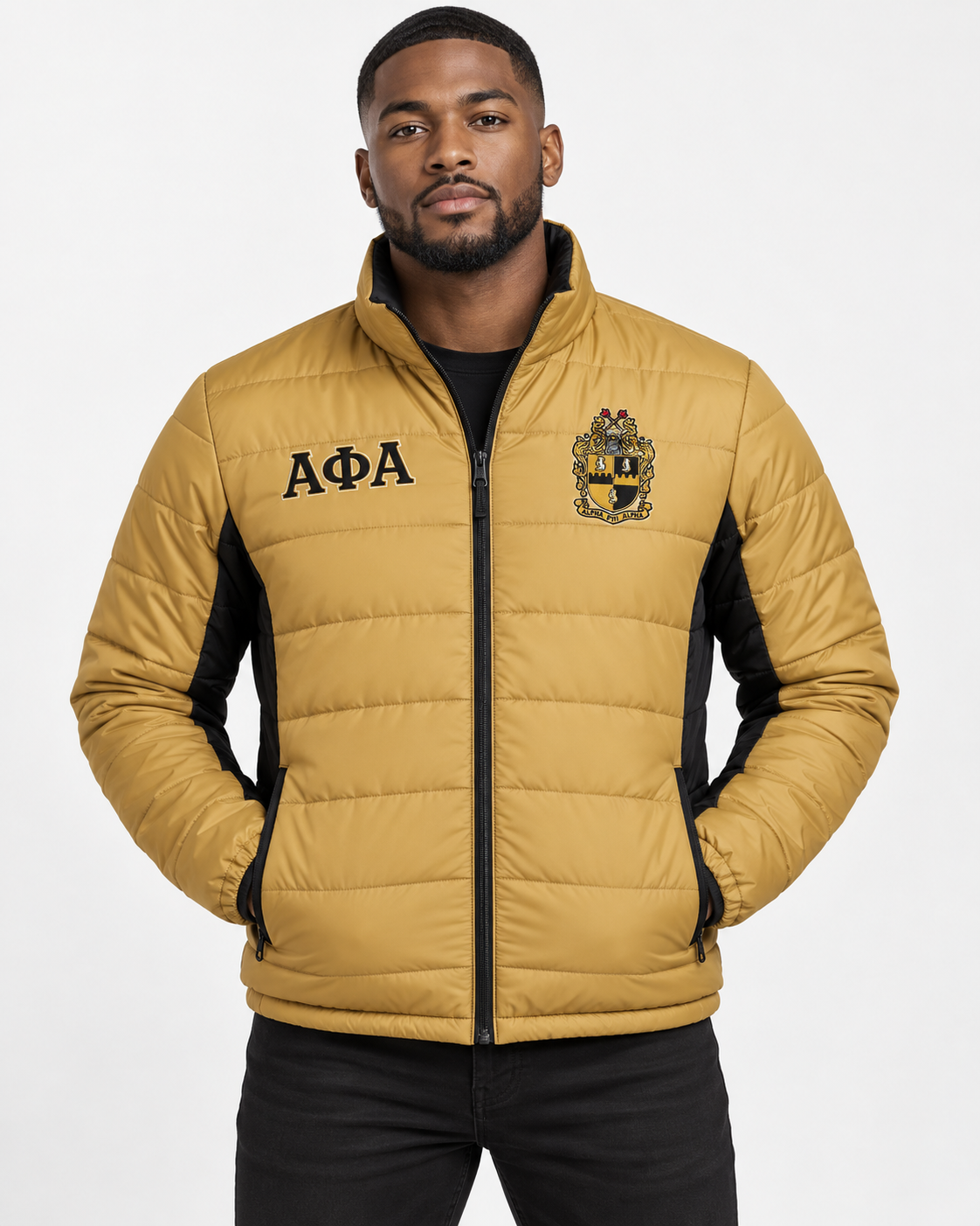 Alpha Phi Alpha old gold puffer jacket with black trim and custom embroidery on male model