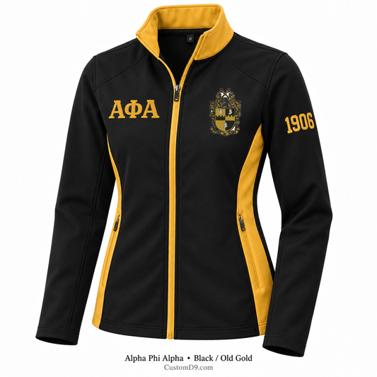Alpha Phi Alpha black and old gold softshell jacket with crest, Greek letters, and 1906 sleeve embroidery