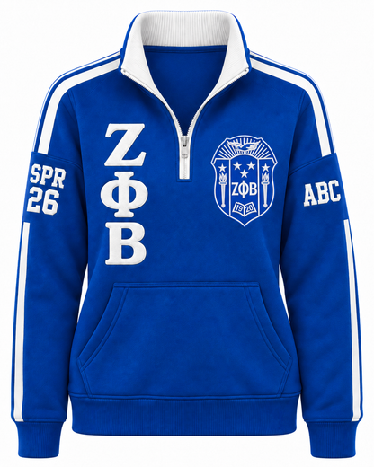 Zeta Phi Beta royal blue and white quarter-zip with crest, Greek letters, and sleeve embroidery