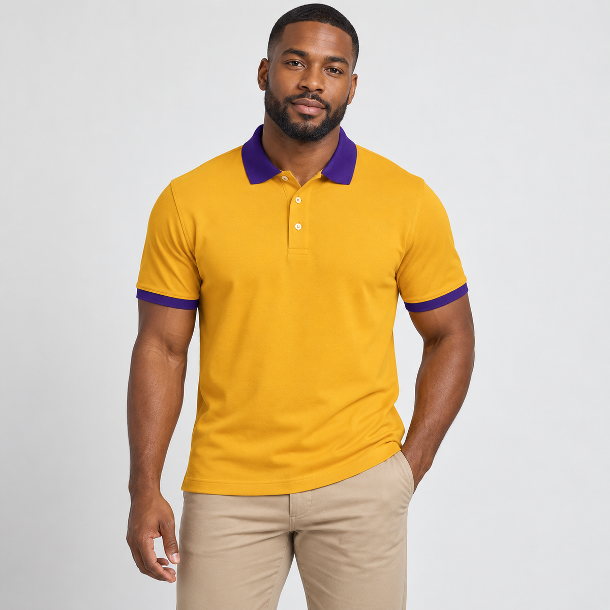 Blank old gold men's polo with royal purple collar and sleeve trim on a model
