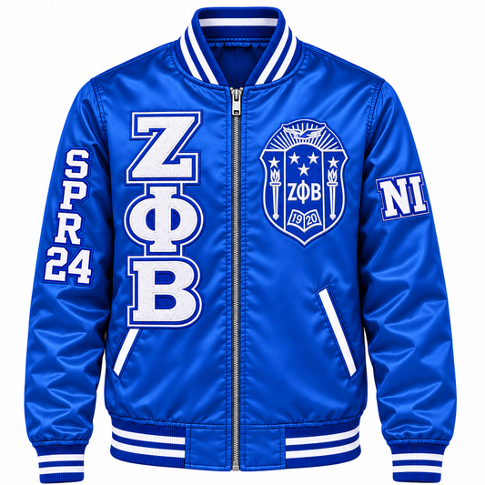 Royal blue and white Zeta Phi Beta satin bomber jacket with crest, stacked letters and sleeve embroidery
