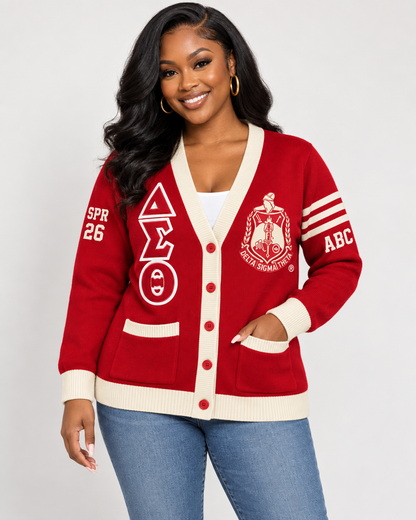 Black female model wearing Delta Sigma Theta crimson and cream embroidered cardigan