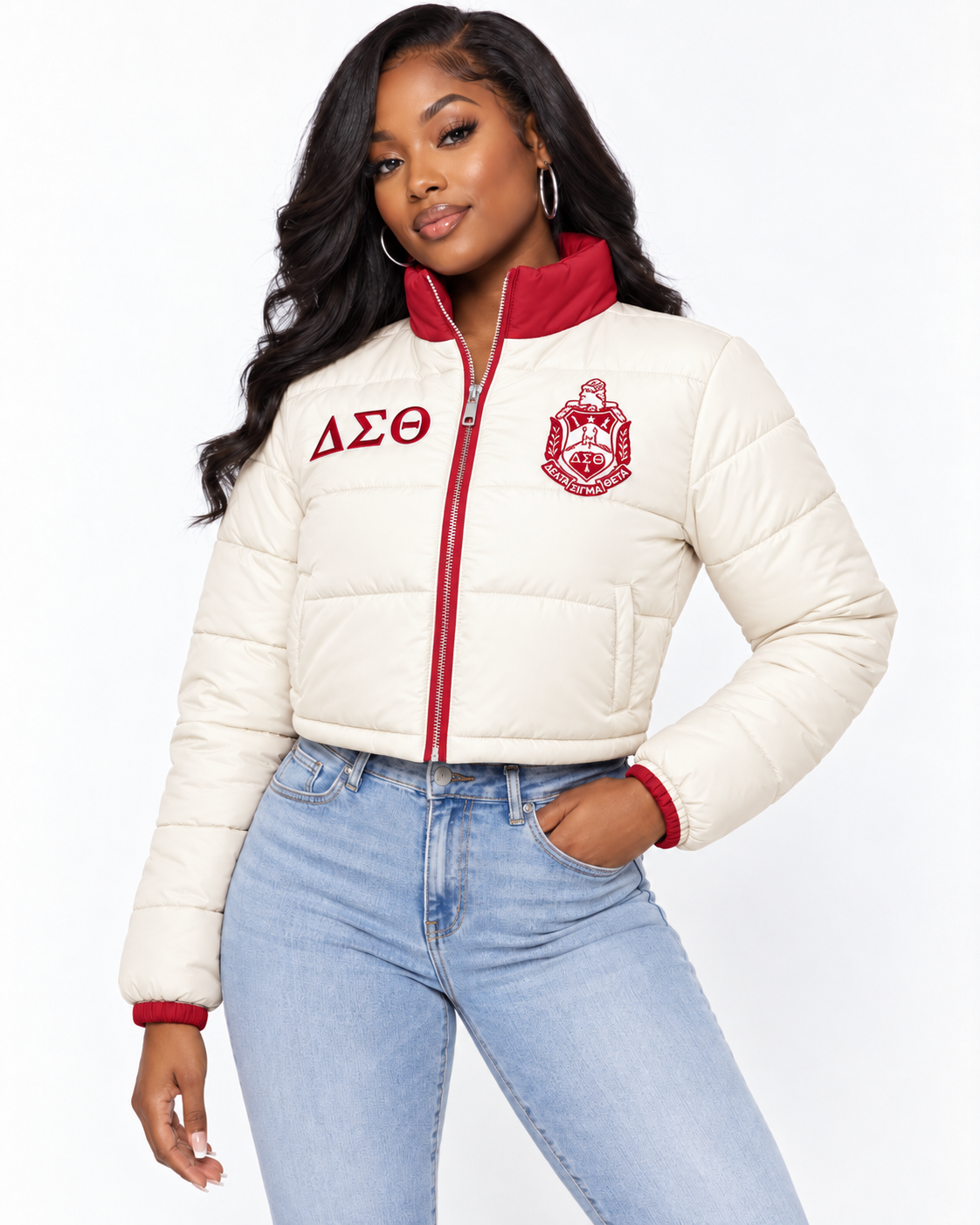 Delta Sigma Theta cream cropped puffer jacket with crimson trim and custom embroidery on female model