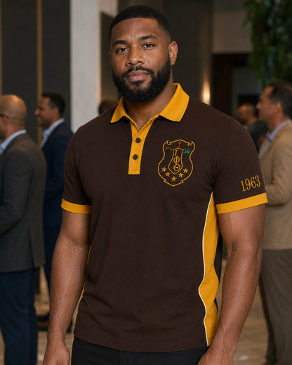 Lifestyle view of an Iota Phi Theta brown and gold embroidered panel polo