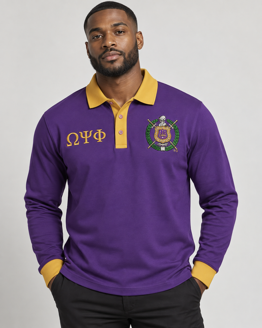 Omega Psi Phi man wearing purple long-sleeve polo with old gold collar, placket, cuffs, crest, and Greek letters
