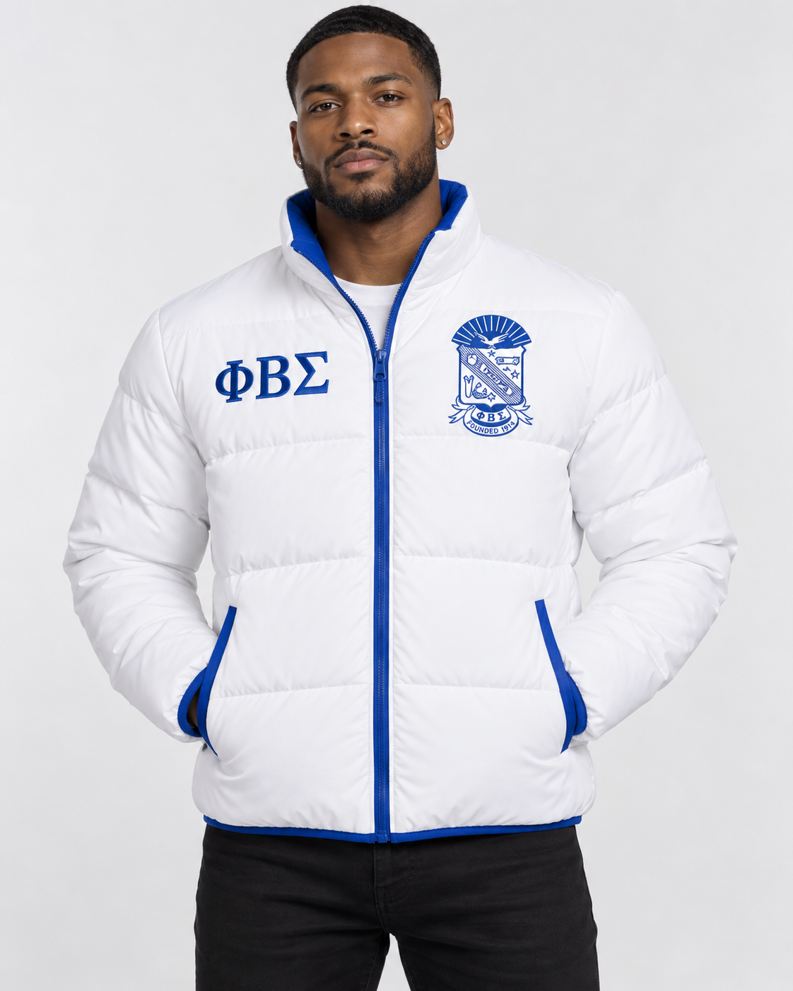 Phi Beta Sigma white puffer jacket with royal blue trim and custom embroidery on male model