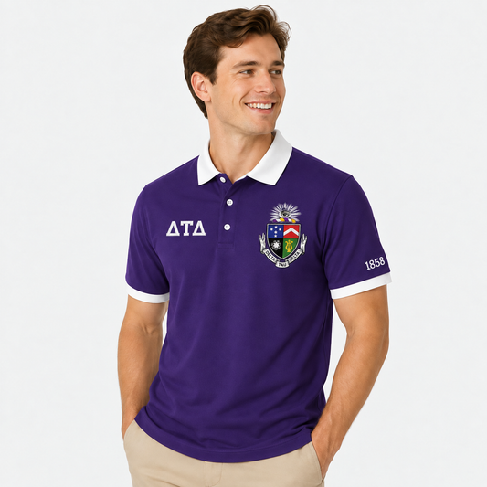 Royal purple Delta Tau Delta polo with white trim, supplied crest on left chest, Greek letters on right chest and 1858 on left sleeve