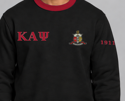 Kappa Alpha Psi premium embroidered black solid contrast trim crewneck sweatshirt on model - chest embroidery close-up
