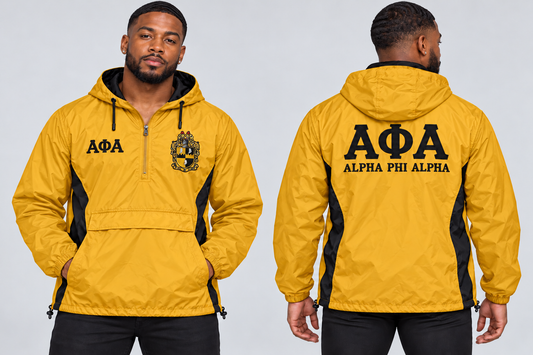 Black man modeling Alpha Phi Alpha old gold and black custom embroidered men's hooded anorak windbreaker jacket, front and back views.