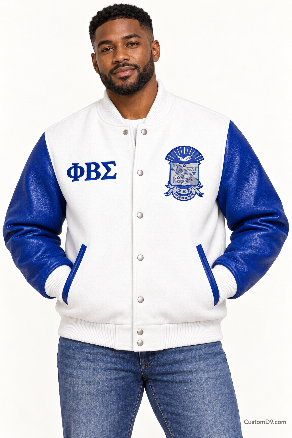 Black man modeling Phi Beta Sigma premium contrast varsity jacket with white body and royal blue sleeves, front view.