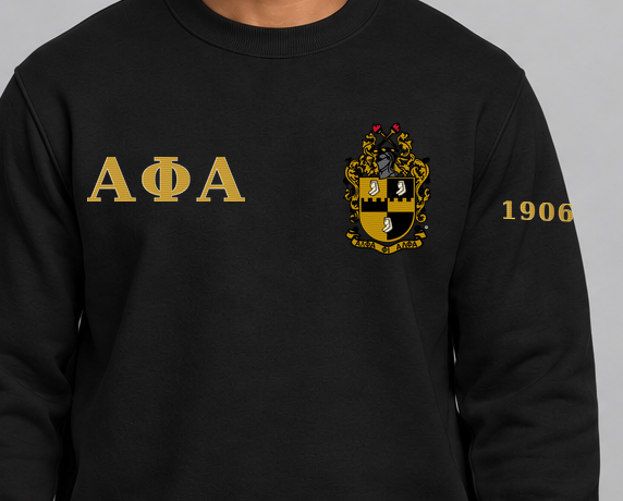 Alpha Phi Alpha premium embroidered black solid crewneck sweatshirt on model - chest embroidery close-up