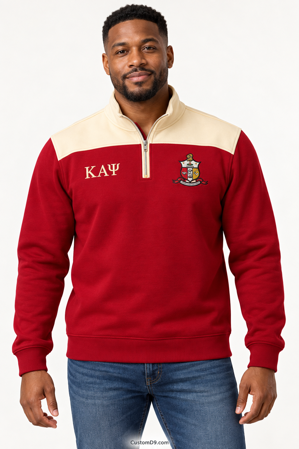 Black male model showing front of Kappa Alpha Psi crimson quarter-zip with cream shoulder panel