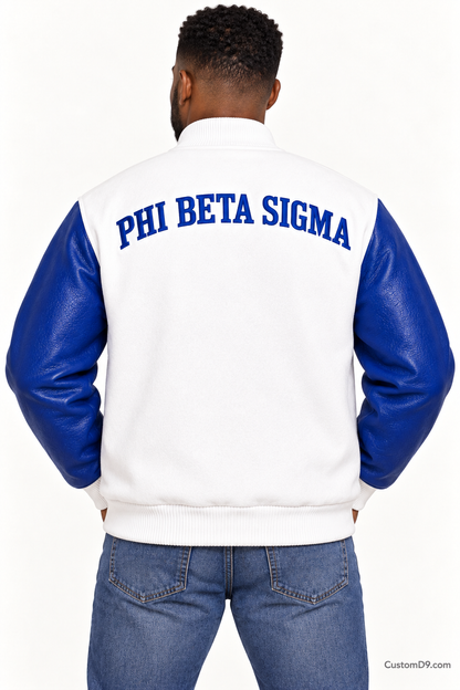 Black man modeling Phi Beta Sigma premium contrast varsity jacket with white body and royal blue sleeves, back view.