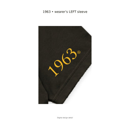 Digital sleeve detail: original gold 1963 artwork on the wearer's LEFT sleeve of the charcoal brown Iota Phi Theta T-shirt