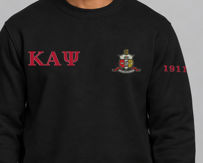 Kappa Alpha Psi premium embroidered black solid crewneck sweatshirt on model - chest embroidery close-up
