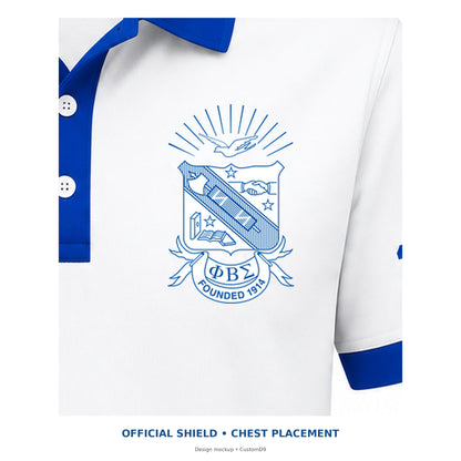 Digital design detail showing the original brand-kit Phi Beta Sigma shield on the white contrast polo's left chest