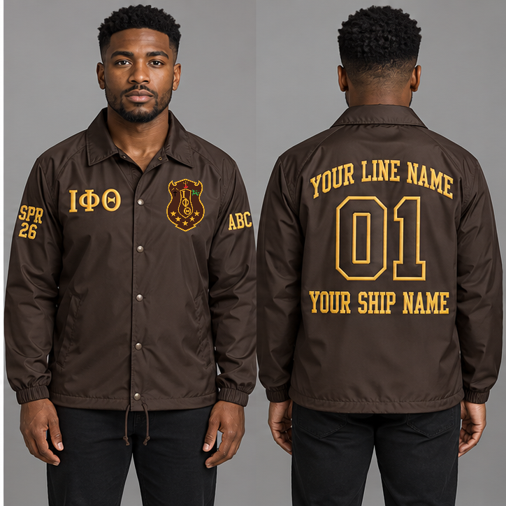Iota Phi Theta Charcoal Brown and Gilded Gold personalized coach line jacket on an adult model, original supplied crest and ΙΦΘ letters, sample line name, line number 01, ship name, crossing year and chapter initials.