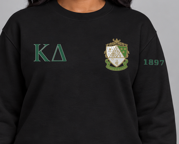 Kappa Delta premium embroidered black solid crewneck sweatshirt on model - chest embroidery close-up