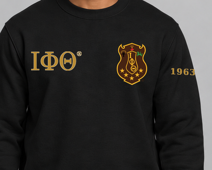 Iota Phi Theta premium embroidered black solid crewneck sweatshirt on model - chest embroidery close-up