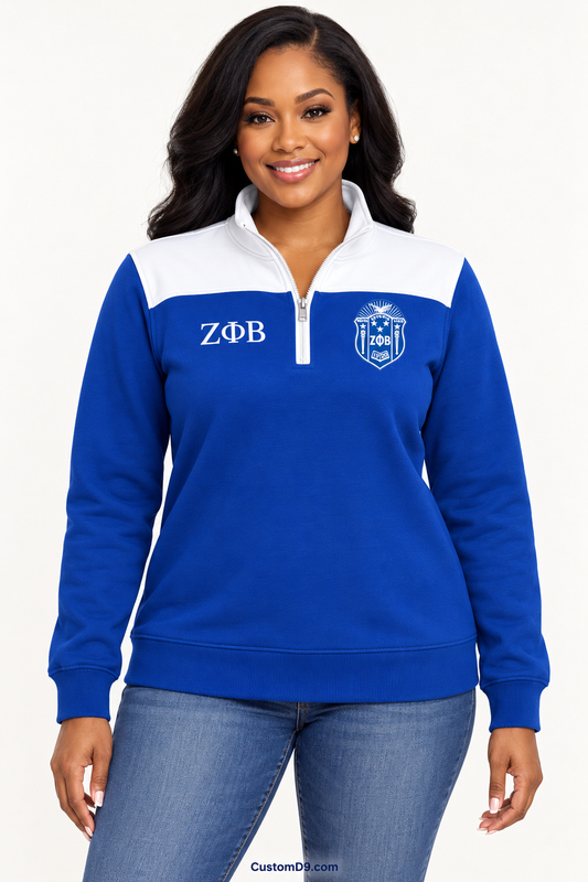Black female model showing front of Zeta Phi Beta royal blue quarter-zip with white shoulder panel
