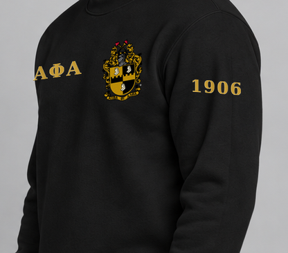 Alpha Phi Alpha premium embroidered black solid crewneck sweatshirt on model - founding year sleeve detail