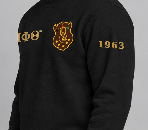 Iota Phi Theta premium embroidered black solid crewneck sweatshirt on model - founding year sleeve detail