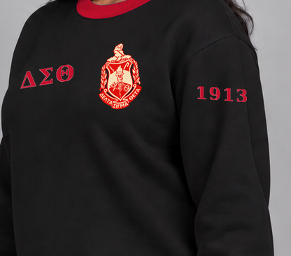 Delta Sigma Theta premium embroidered black solid contrast trim crewneck sweatshirt on model - founding year sleeve detail