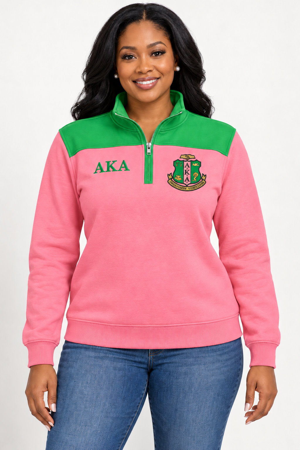 Black female model showing front of Alpha Kappa Alpha salmon pink quarter-zip with apple green shoulder panel