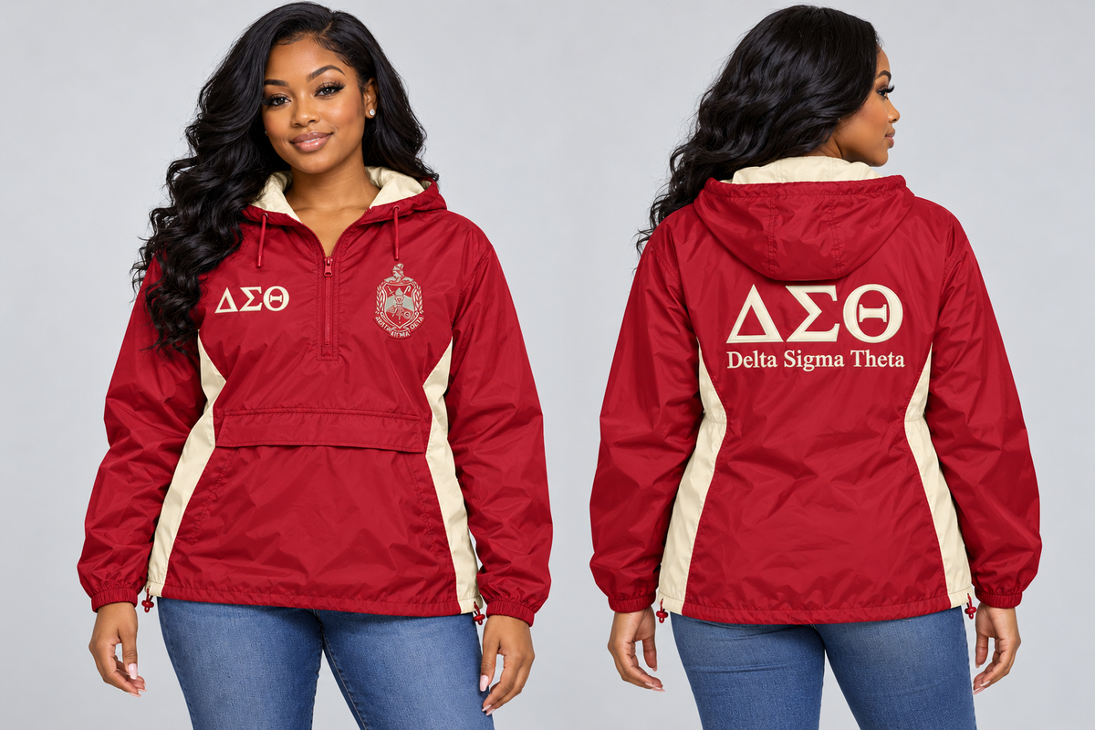 Black woman modeling Delta Sigma Theta crimson and cream custom embroidered hooded anorak windbreaker jacket, front and back views.