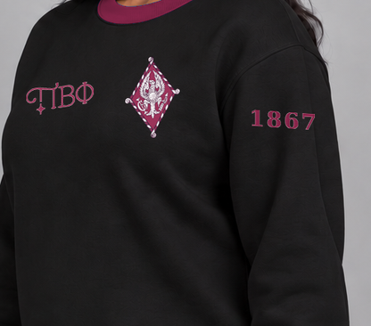Pi Beta Phi premium embroidered black solid contrast trim crewneck sweatshirt on model - founding year sleeve detail