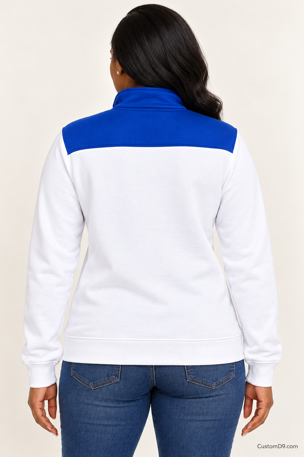 Black female model showing back of Zeta Phi Beta white quarter-zip with royal blue shoulder panel