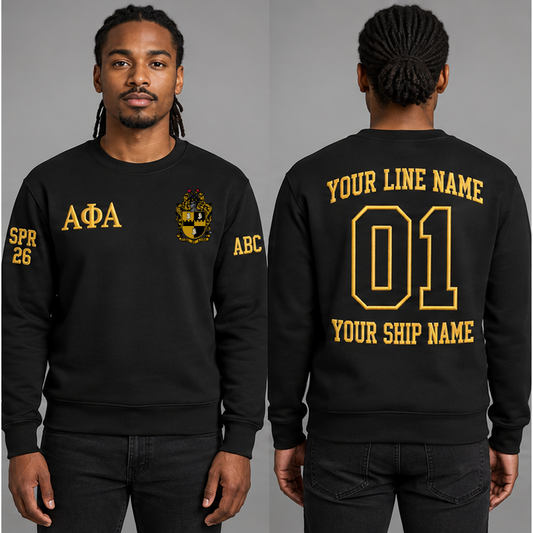 Alpha Phi Alpha Black crewneck sweatshirt on an adult model, Old Gold Greek letters ΑΦΑ, original supplied crest, sample line name, line number 01 and ship name, right sleeve SPR 26 and left sleeve ABC.