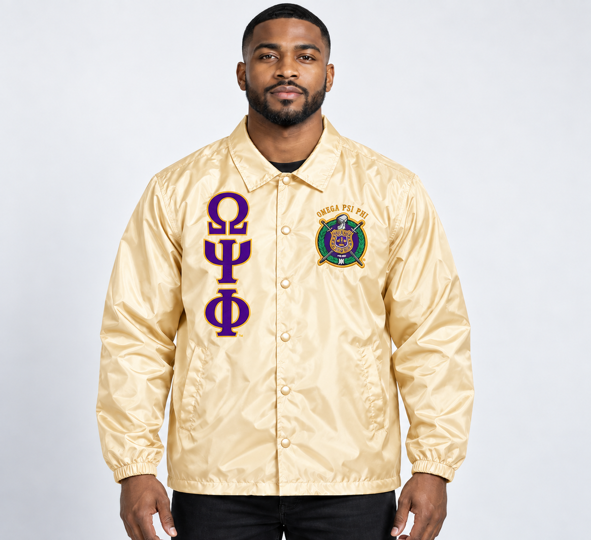 Cream Omega Psi Phi line jacket on male model