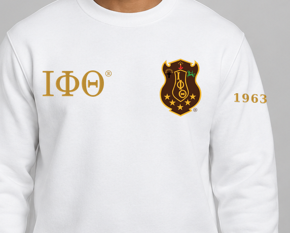 Iota Phi Theta premium embroidered white solid crewneck sweatshirt on model - chest embroidery close-up