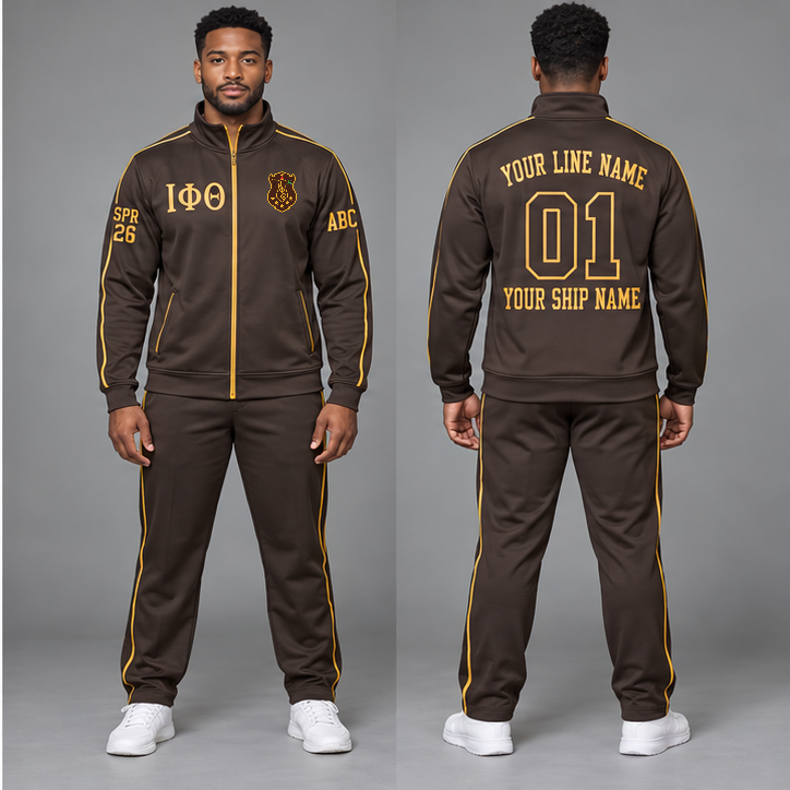 Iota Phi Theta Charcoal Brown and Gilded Gold personalized track suit on an adult model, original supplied crest and ΙΦΘ letters, sample line name, line number 01, ship name, crossing year and chapter initials.