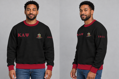 Kappa Alpha Psi premium embroidered black solid contrast trim crewneck sweatshirt on model - front and side