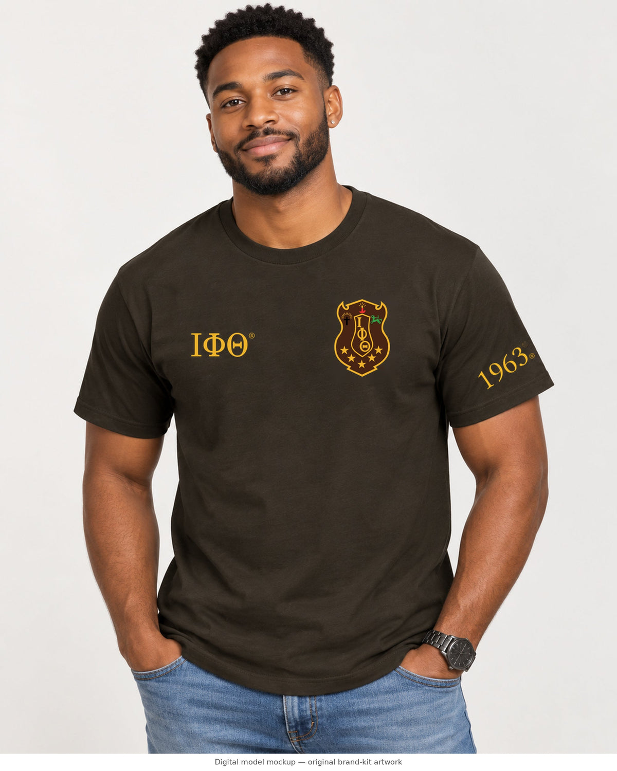 Digital model mockup: adult male wearing the charcoal brown Iota Phi Theta T-shirt; original shield, Greek letters and 1963 artwork directly composited from the brand kit