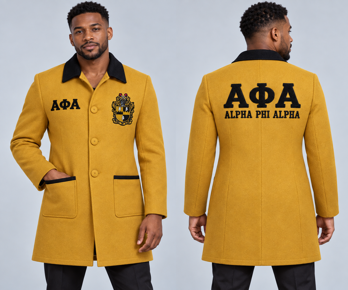 Black male model wearing Alpha Phi Alpha fitted premium wool blend coat in old gold and black, premium chenille Greek letters and embroidered crest, front and back views.