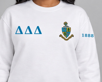 Delta Delta Delta premium embroidered white solid crewneck sweatshirt on model - chest embroidery close-up