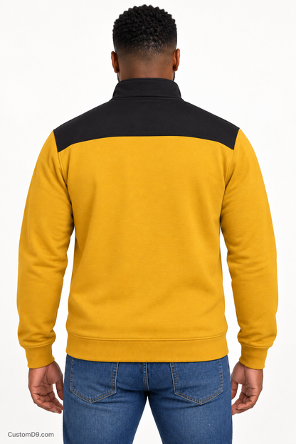 Black male model showing back of Alpha Phi Alpha old gold quarter-zip with black shoulder panel